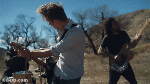Man Playing Guitar In Field GIF