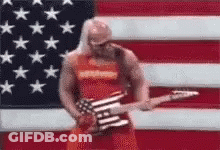 Man Playing Guitar In Front Of American Flag GIF