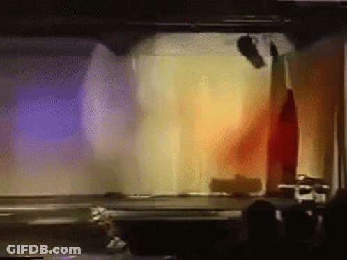 Man Playing Guitar In Front Of Band Saying Calling All The Heroes GIF