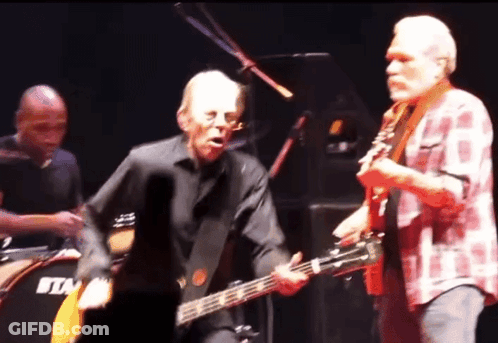 Man Playing Guitar In Front Of Drum Saying Tim GIF