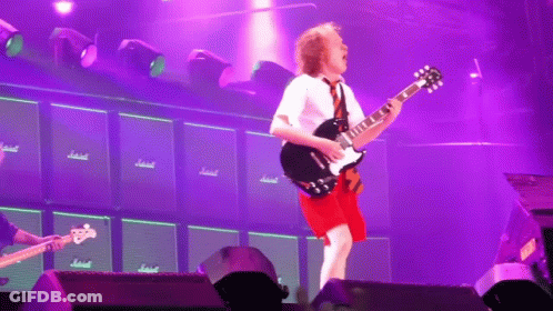 Man Playing Guitar In Front Of Marshall Amps GIF