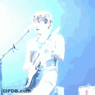 Man Playing Guitar In Front Of Microphone GIF