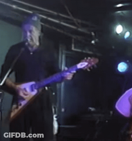 Man Playing Guitar In Front Of Microphone GIF