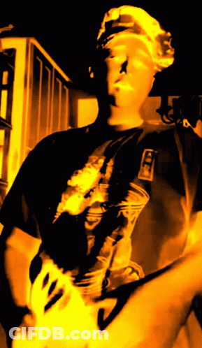Man Playing Guitar In Ice Shirt GIF