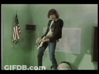 Man Playing Guitar Near American Flag GIF