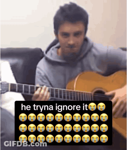 Man Playing Guitar Next To Keyboard Saying He Tryna Ignore It GIF