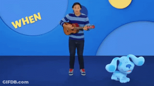 Man Playing Guitar Next To Stuffed Blue Dog Saying When GIF