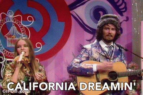 Man Playing Guitar Next To Woman Eating Banana GIF