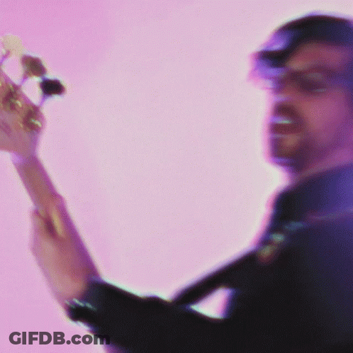 Man Playing Guitar On Pink Background GIF