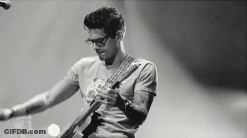 Man Playing Guitar On Stage Black And White GIF
