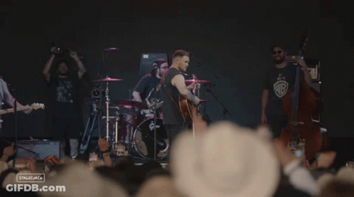 Man Playing Guitar On Stage GIF