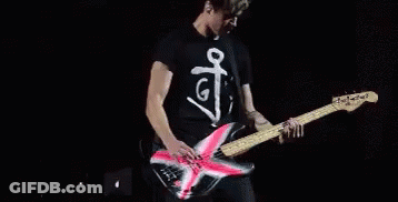 Man Playing Guitar On Stage Saying G GIF