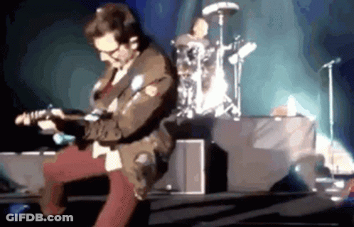 Man Playing Guitar On Stage With Drummer GIF