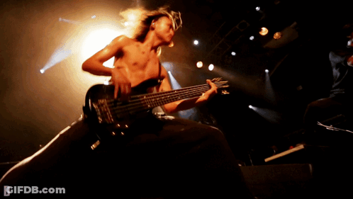 Man Playing Guitar On Stage With Letter D GIF