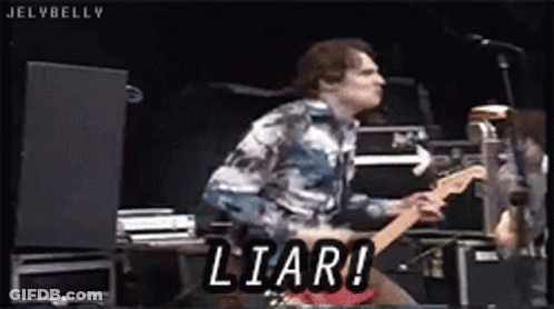 Man Playing Guitar On Stage With Liar GIF