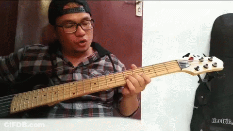 Man Playing Guitar Saying Electric GIF