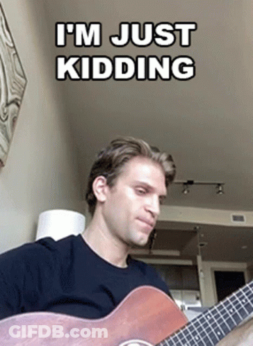 Man Playing Guitar Saying I'm Just Kidding GIF