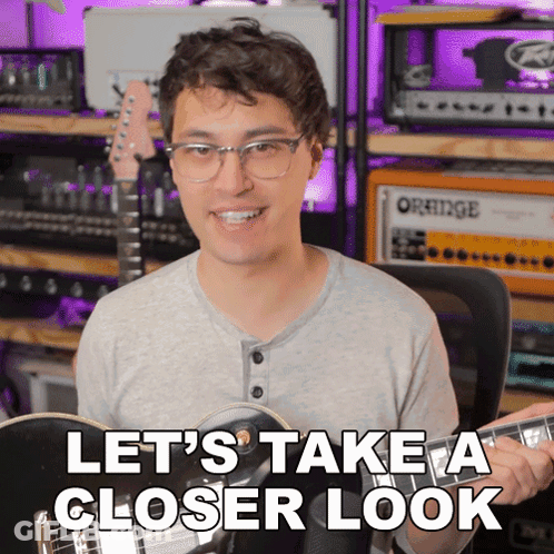 Man Playing Guitar Saying Let's Take A Closer Look GIF