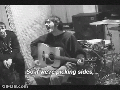 Man Playing Guitar Saying Picking Sides GIF