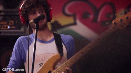 Man Playing Guitar Singing Peach Shirt GIF