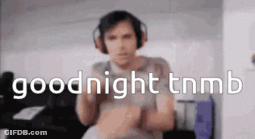 Man Playing Guitar While Another Lays On Stage GIF