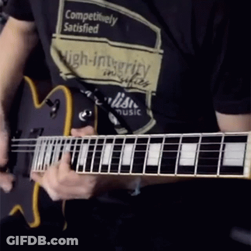 Man Playing Guitar With Competitively Satisfied Shirt GIF