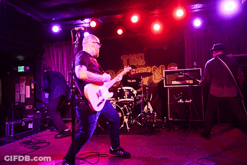 Man Playing Guitar With Exit Sign GIF