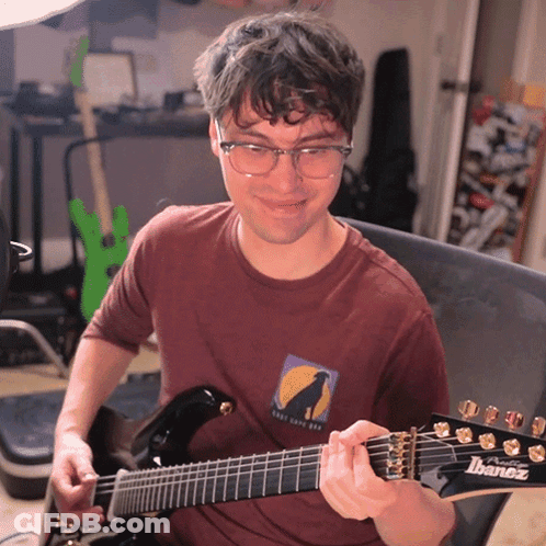 Man Playing Guitar With Shirt That Says Ibanez GIF