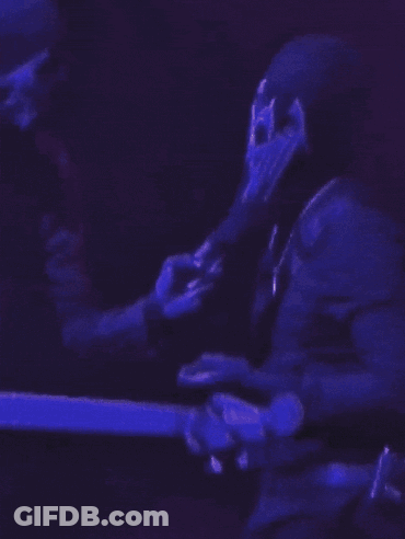 Man Playing Guitar With Skull Face GIF