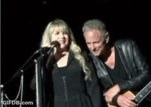 Man Playing Guitar Woman Singing Into Microphone GIF
