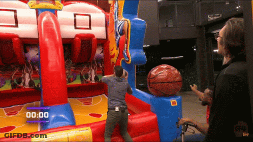 Man Playing Inflatable Basketball Game With Timer 00:00 GIF