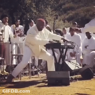 Man Playing Keyboard In Front Of Crowd GIF