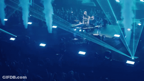 Man Playing Keyboard On Stage With Smoke GIF