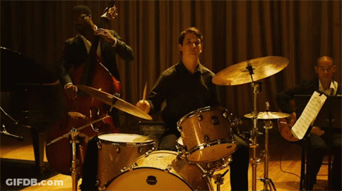 Man Playing Maple Drum Set GIF