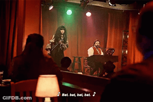 Man Playing Piano And Woman Singing On Stage GIF