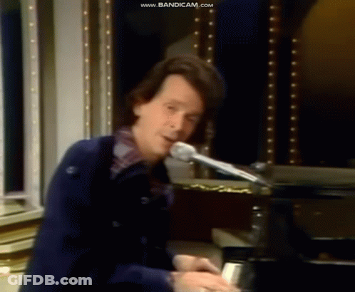 Man Playing Piano At Microphone GIF