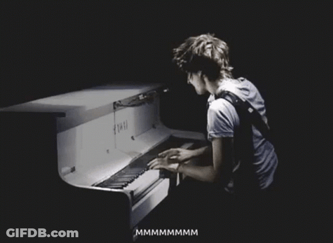 Man Playing Piano In Dark GIF