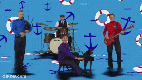 Man Playing Piano In Front Of Tama Drum Set GIF