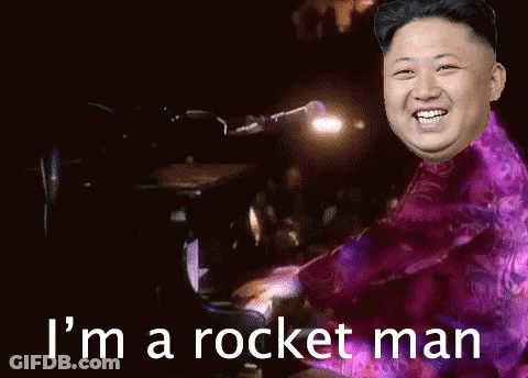 Man Playing Piano With I'm A Rocket Man Behind GIF