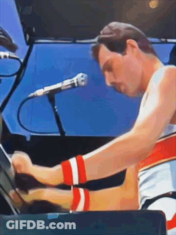 Man Playing Piano With Microphone GIF
