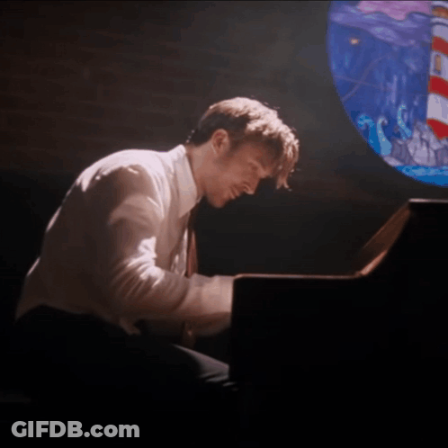 Man Playing Piano With Stained Glass Window GIF