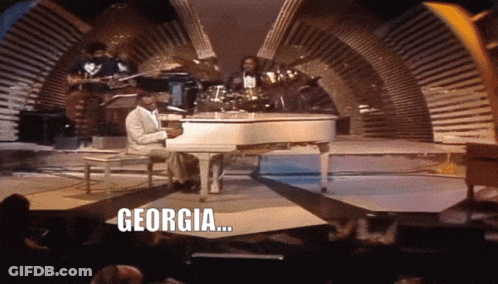 Man Playing Piano With Word Georgia GIF
