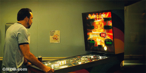 Man Playing Pinball Machine Saying Arcade GIF