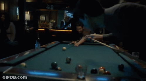 Man Playing Pool In Dark Bar GIF