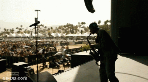 Man Playing Saxophone At Cachella Festival GIF
