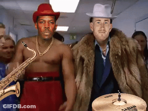 Man Playing Saxophone Next To Man Playing Sabian Cymbal GIF