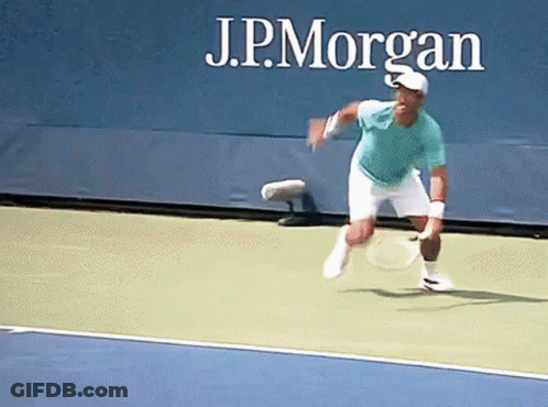 Man Playing Tennis Behind J.P. Morgan Sign GIF