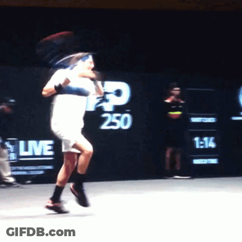 Man Playing Tennis In Front Of 250 Wall GIF