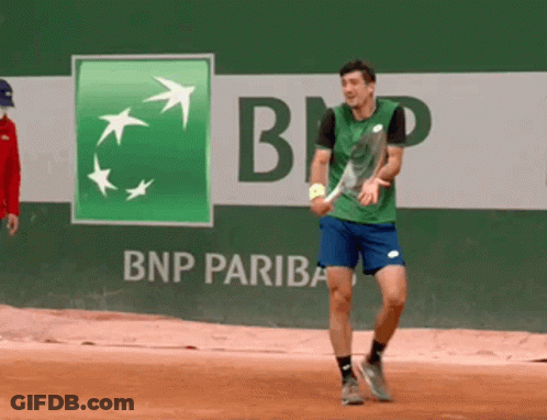 Man Playing Tennis In Front Of BNP Pariba Ad GIF