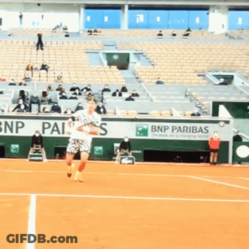 Man Playing Tennis In Front Of BNP Pariba Sign GIF